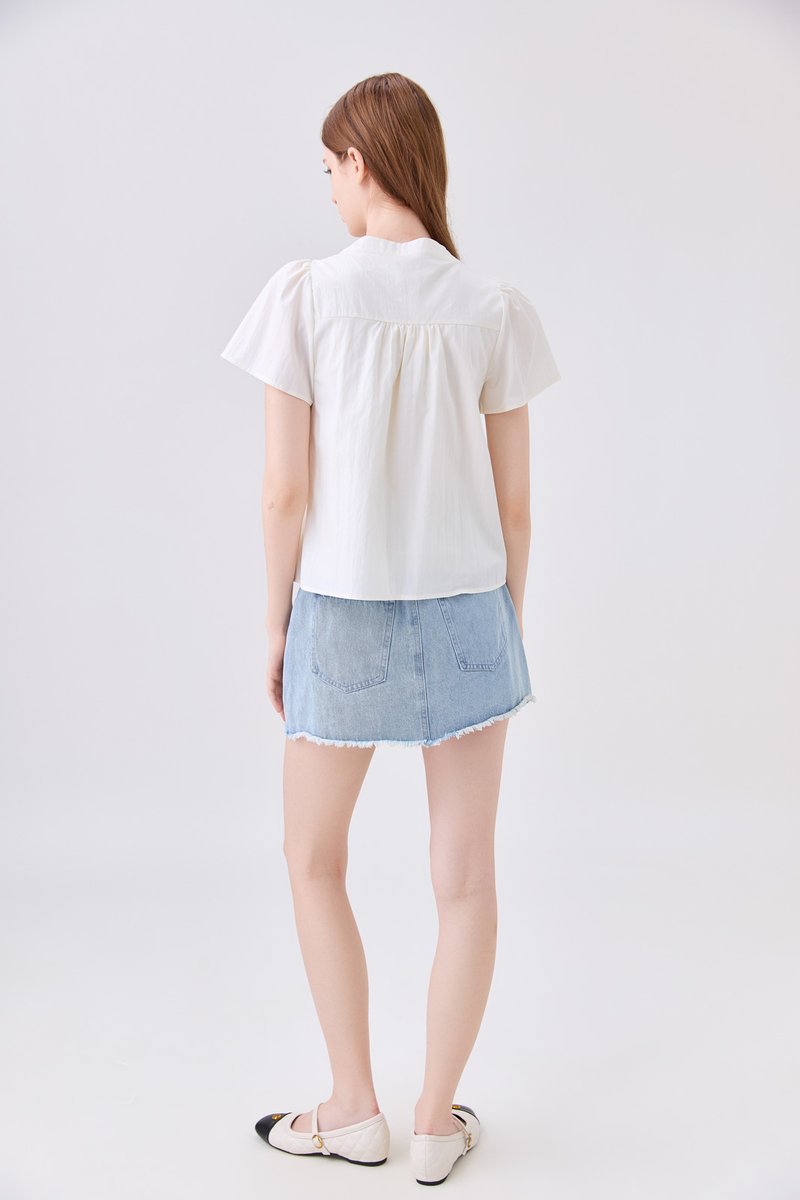 Journee Pintuck Ribbon Top In Cream