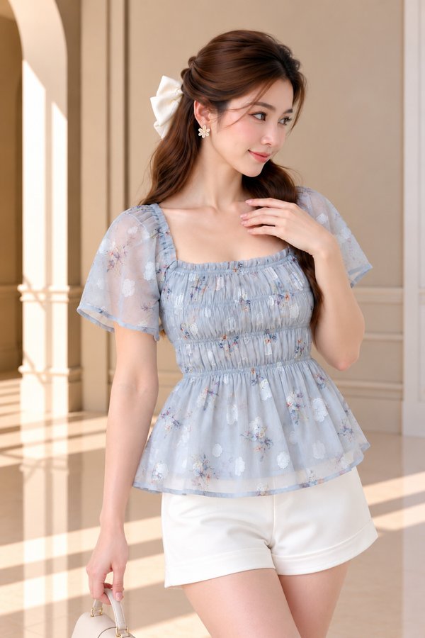 Maelle Floral Smocked Flutter Sleeve Top In Misty Blue